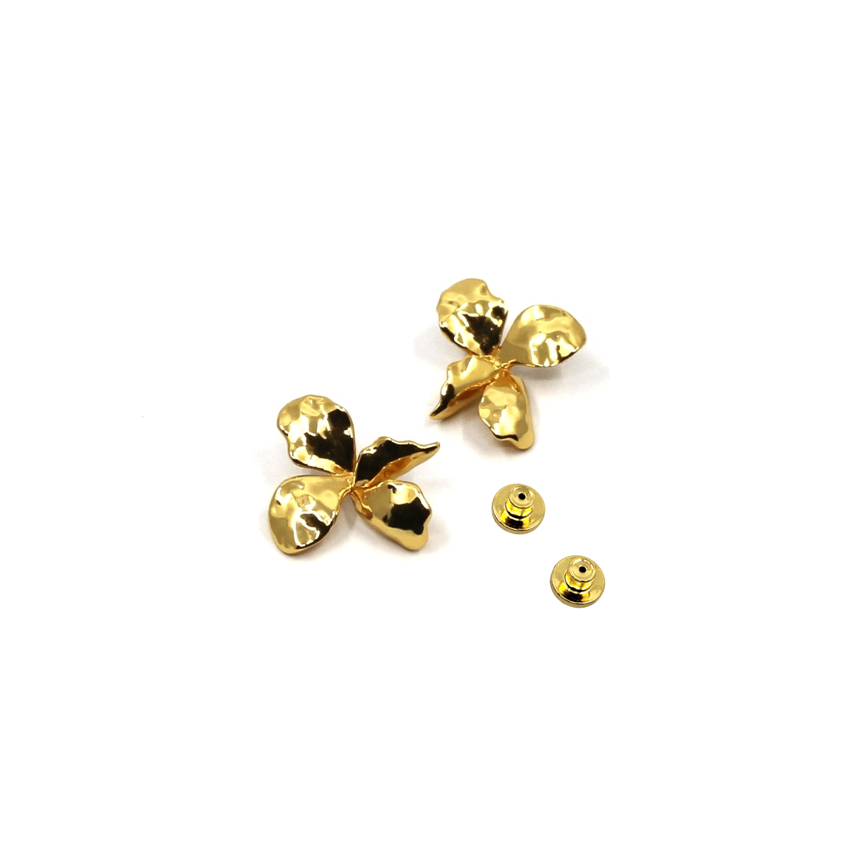 Gold flower earrings on a white background with backing