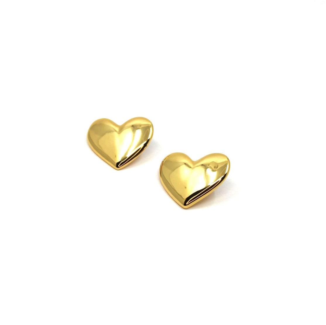 Gold heart-shaped earrings on a white background