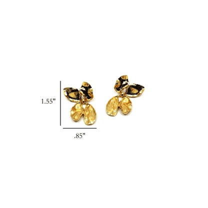 Gold flower petal-shaped earrings on a white background
