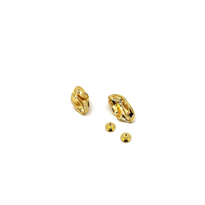 Gold wave earrings on a white background with backs