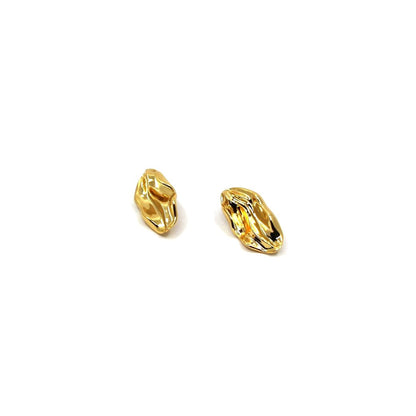 Pair of gold wave earrings on a white background
