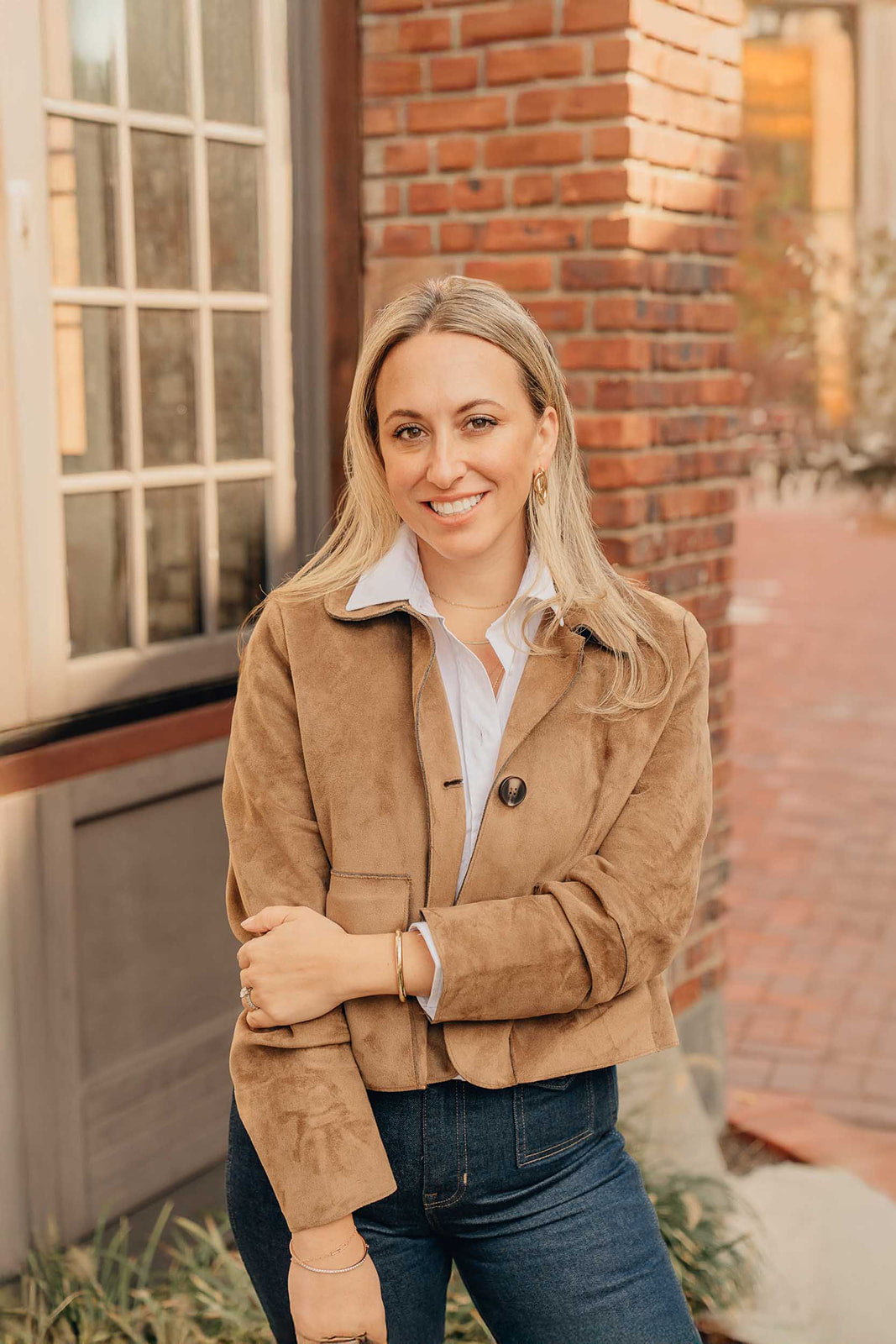 Jaclyn Orsini, founder of MARKT HOUSE jewelry brand, wearing classic statement earrings and a timeless classic neutral outfit.